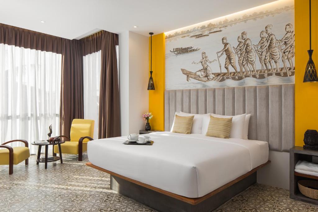 Postel nebo postele na pokoji v ubytování Siem Reap Palace Hotel & Spa