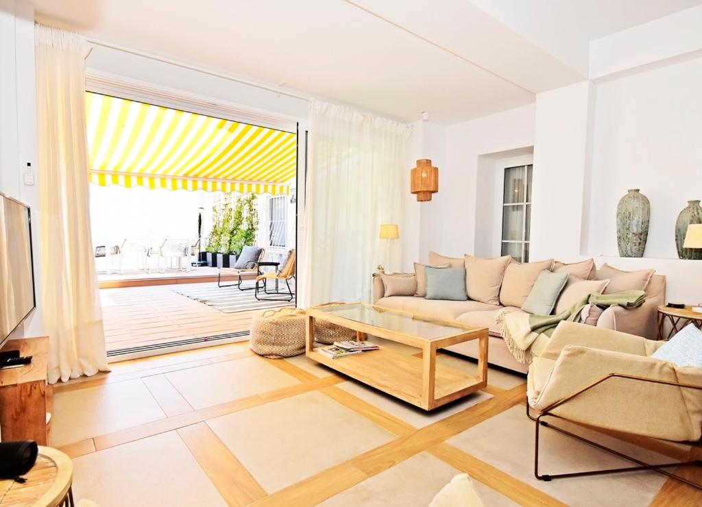 A seating area at 70sqm private terrace in front of the sea & 107sqm brand new apartment