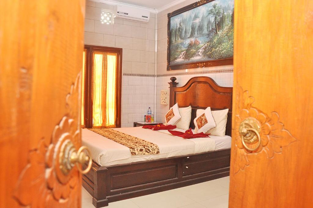 Postel nebo postele na pokoji v ubytování Astiti Guest House Salon and Spa