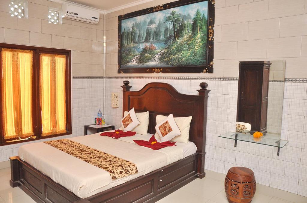 Postel nebo postele na pokoji v ubytování Astiti Guest House Salon and Spa