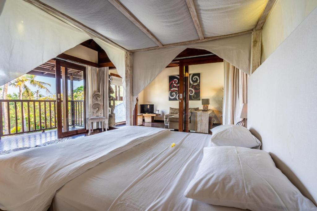 Postel nebo postele na pokoji v ubytování Pristine Yuyu Villa Balian