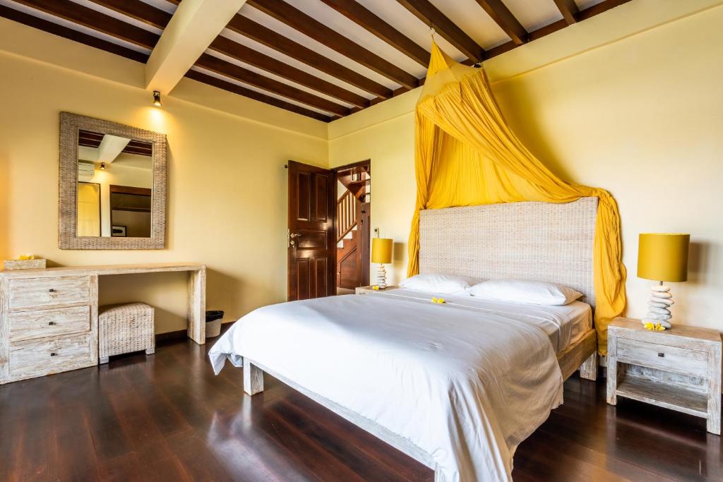 Postel nebo postele na pokoji v ubytování Pristine Yuyu Villa Balian