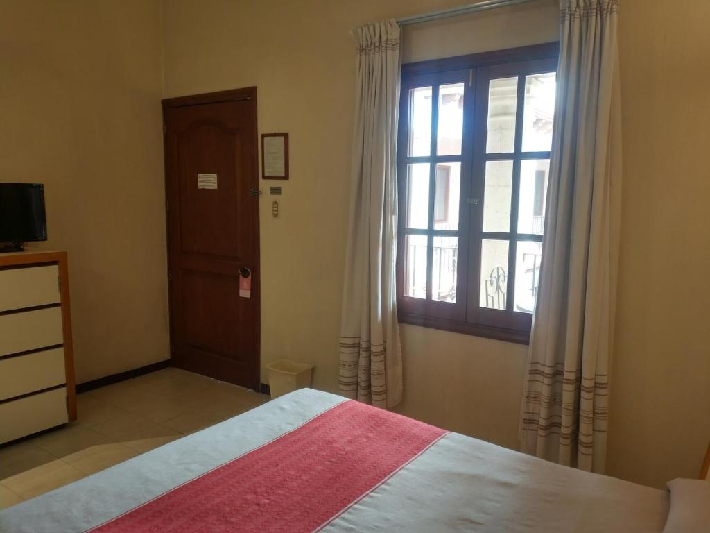 Postel nebo postele na pokoji v ubytování Hotel Ferri