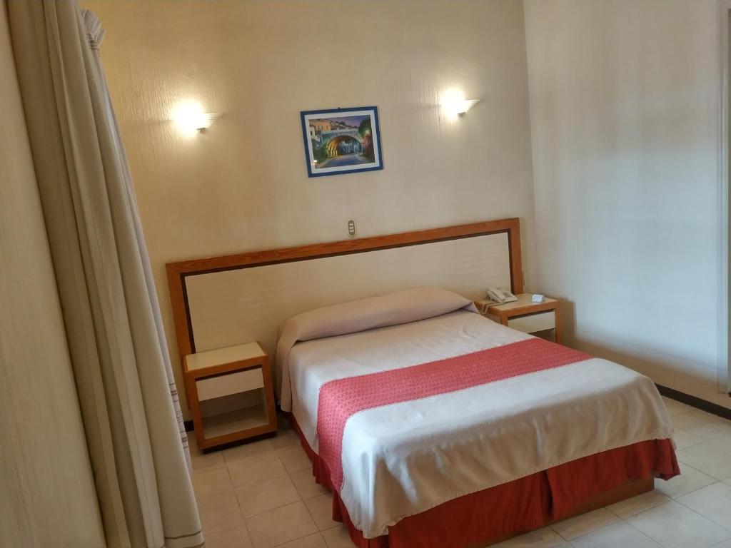 Postel nebo postele na pokoji v ubytování Hotel Ferri
