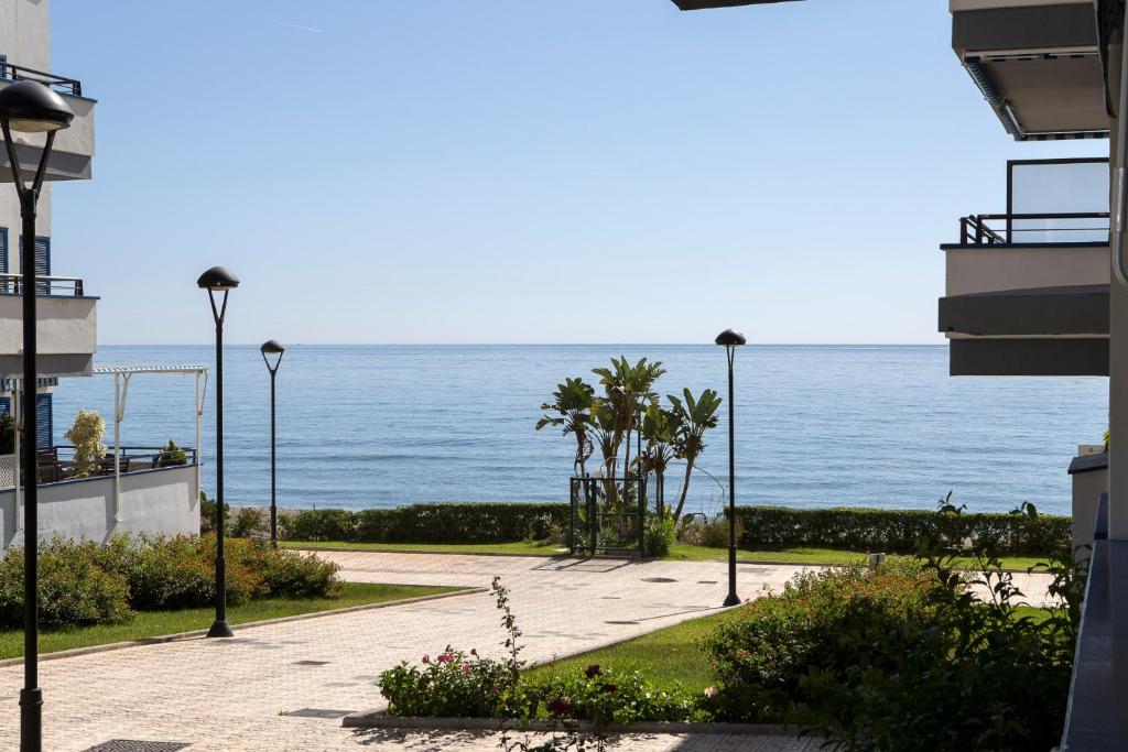 a view of the ocean from a building at Beach House Torrox in Torrox Costa