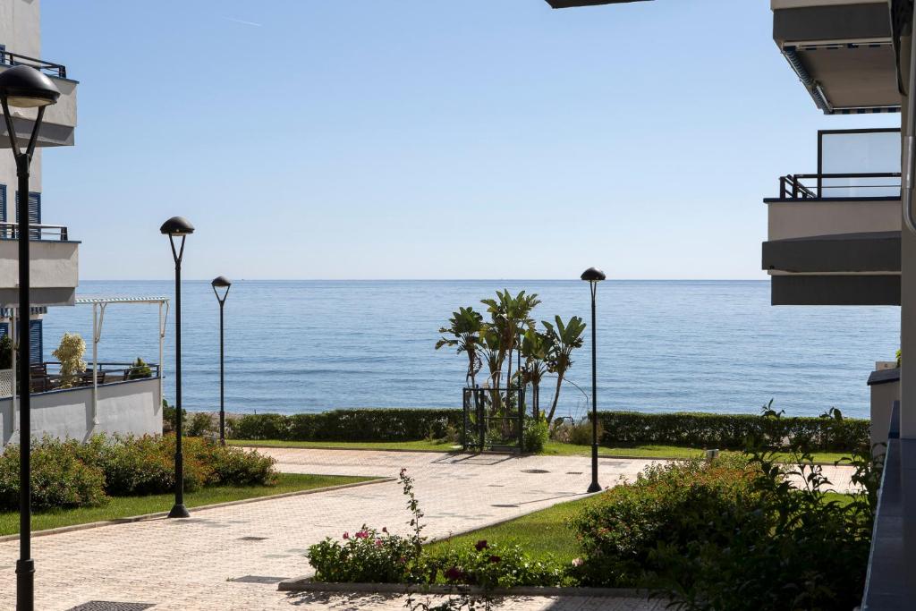 a view of the ocean from a building at Apartamento Torrox in Torrox Costa