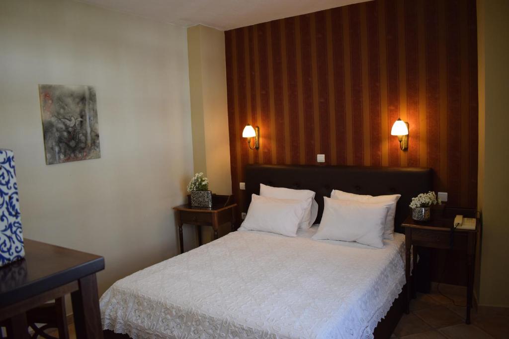 En eller flere senger på et rom på Hagiati Anastasiou Hotel & Spa