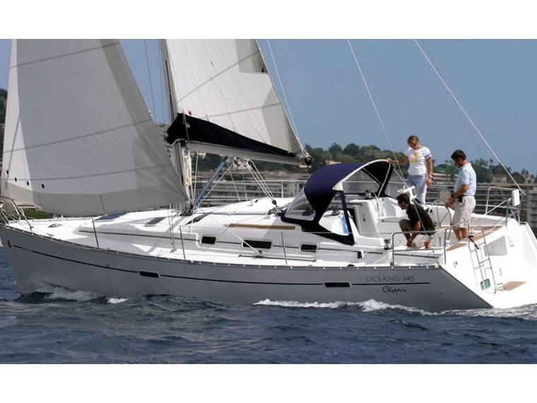 three people on a sail boat in the water at Boat in Badalona for up to 6 people in Badalona