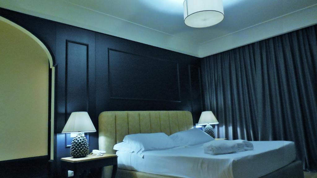 Postel nebo postele na pokoji v ubytování Hotel Marechiaro