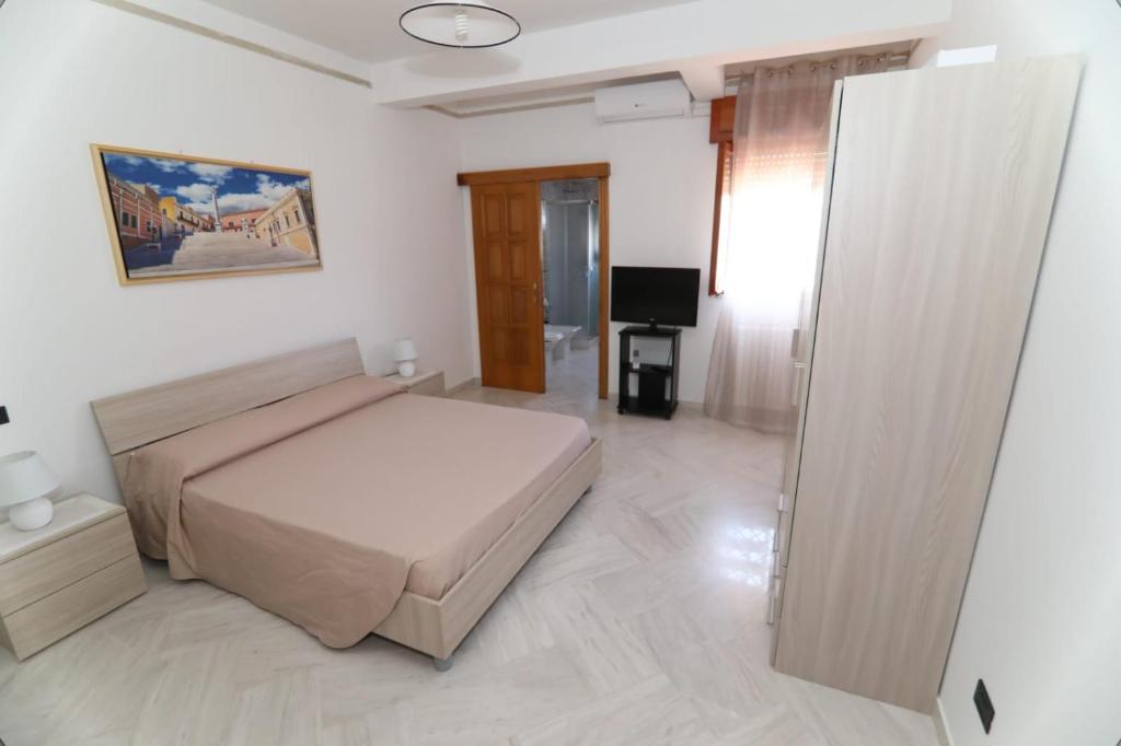 Posteľ alebo postele v izbe v ubytovaní B&B Annunziata
