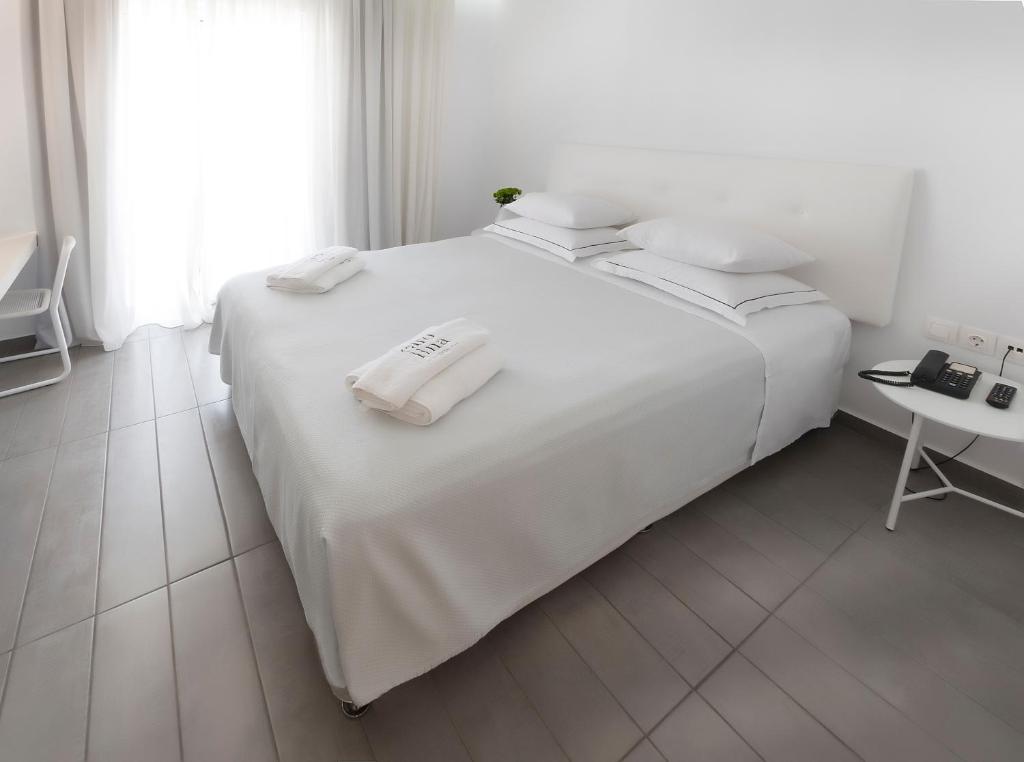 Postel nebo postele na pokoji v ubytování Carolina Hotel since 1934