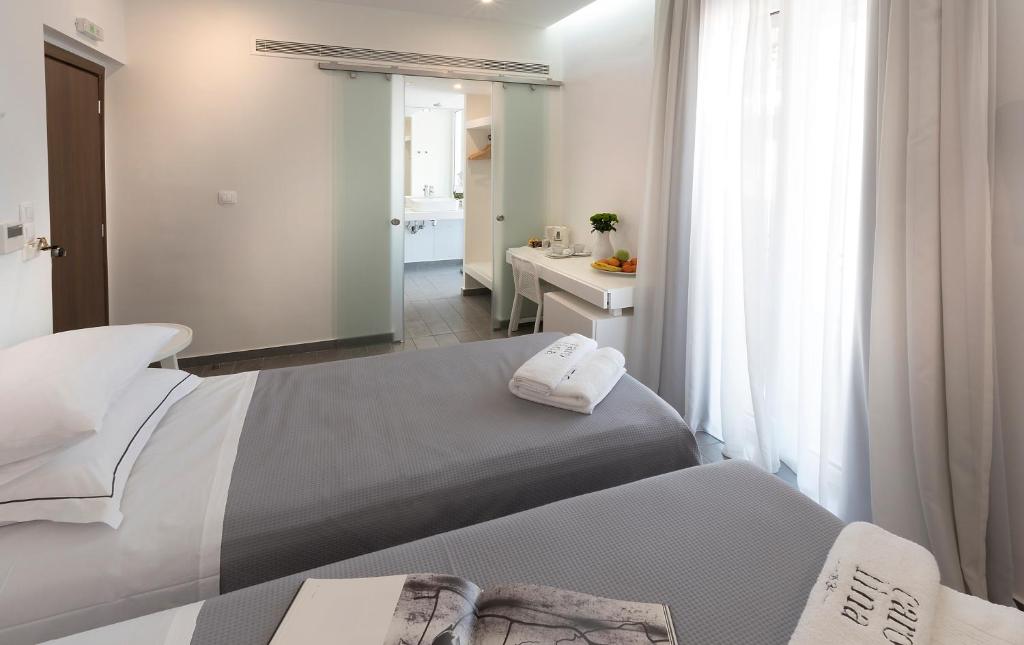 Postel nebo postele na pokoji v ubytování Carolina Hotel since 1934