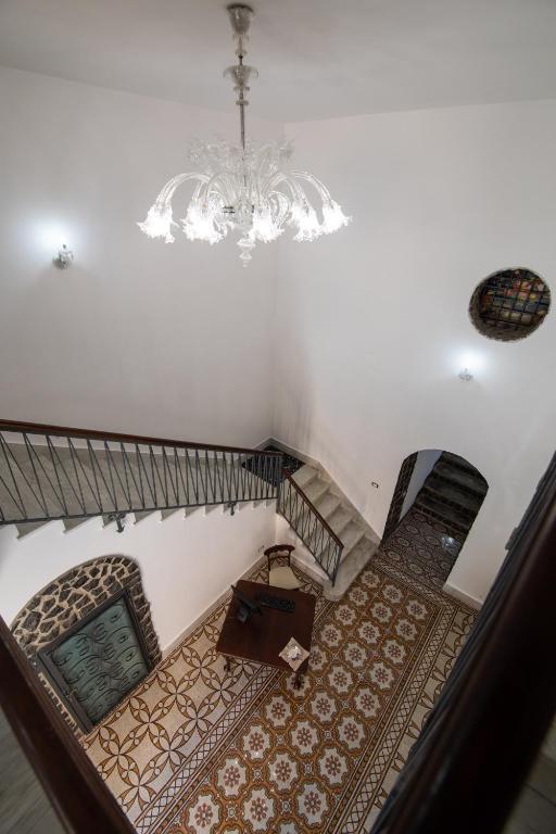 Posteľ alebo postele v izbe v ubytovaní Palazzo Caracciolo del Sole