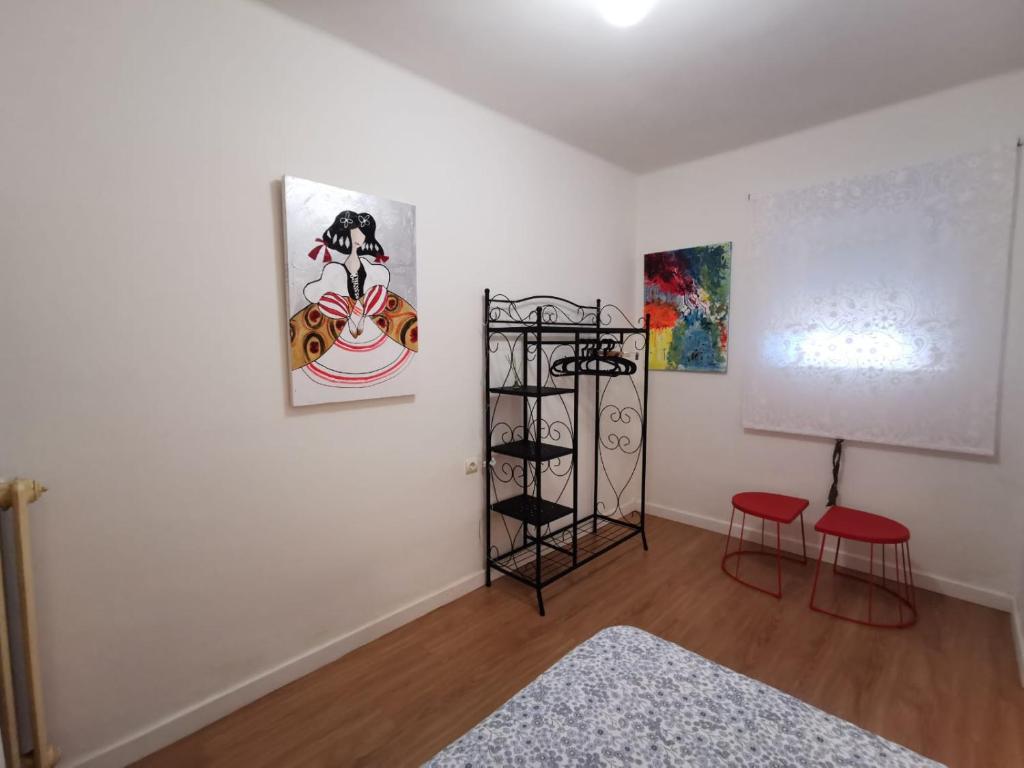 A bed or beds in a room at Casa Coqueta y confortable en Oviedo