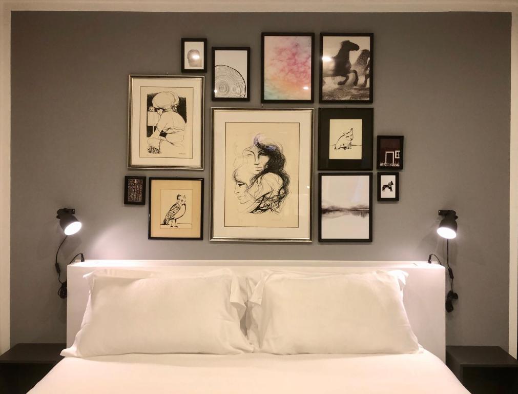 Posteľ alebo postele v izbe v ubytovaní Mimì Rooms&Studios