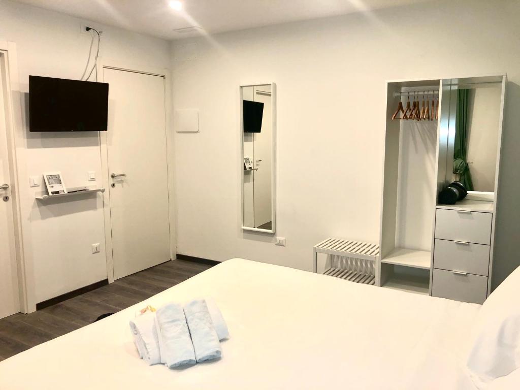 Posteľ alebo postele v izbe v ubytovaní Mimì Rooms&Studios