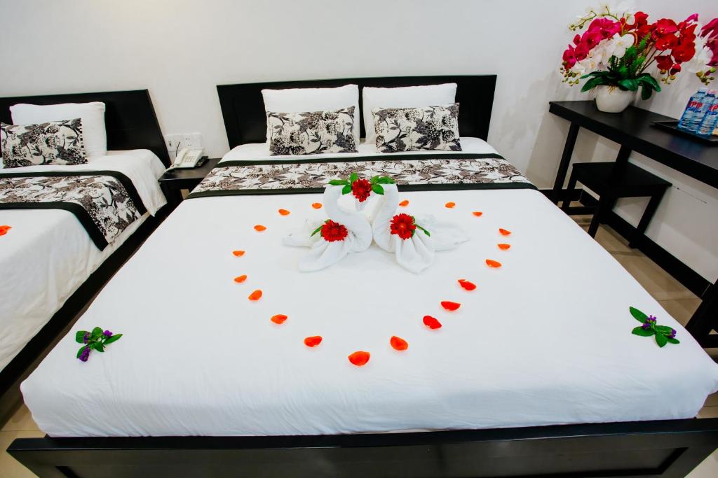 Postel nebo postele na pokoji v ubytování Hoianation Villas Hotel