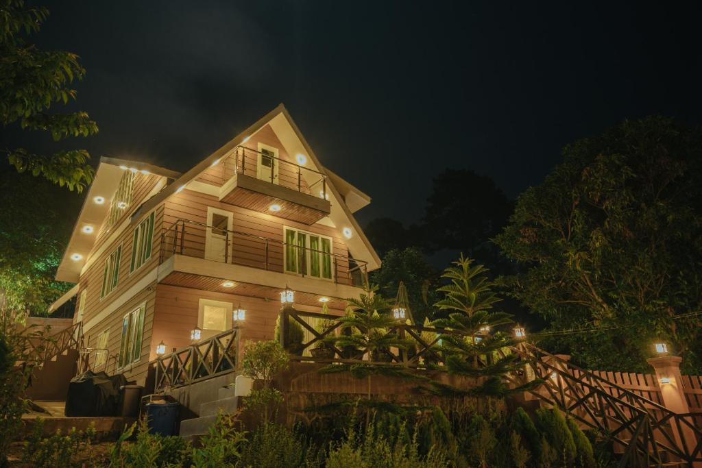 a house at night with lights on it at The Pine Yard in Kalaw