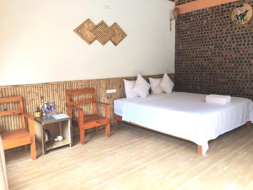 Postel nebo postele na pokoji v ubytování Tam Coc Summer Bungalow