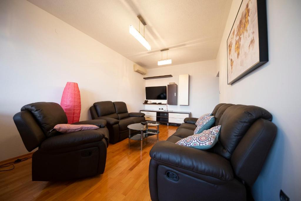 Televízia a/alebo spoločenská miestnosť v ubytovaní City&Sea view 2BR 4+2