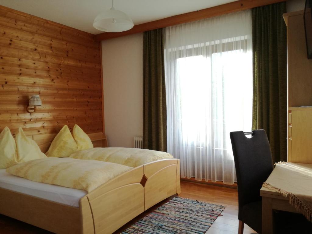 Postel nebo postele na pokoji v ubytování Lasserhof