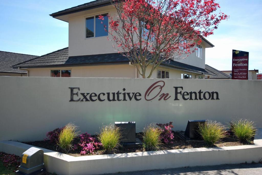 a sign that reads executive on feature in front of a house at Executive On Fenton in Rotorua