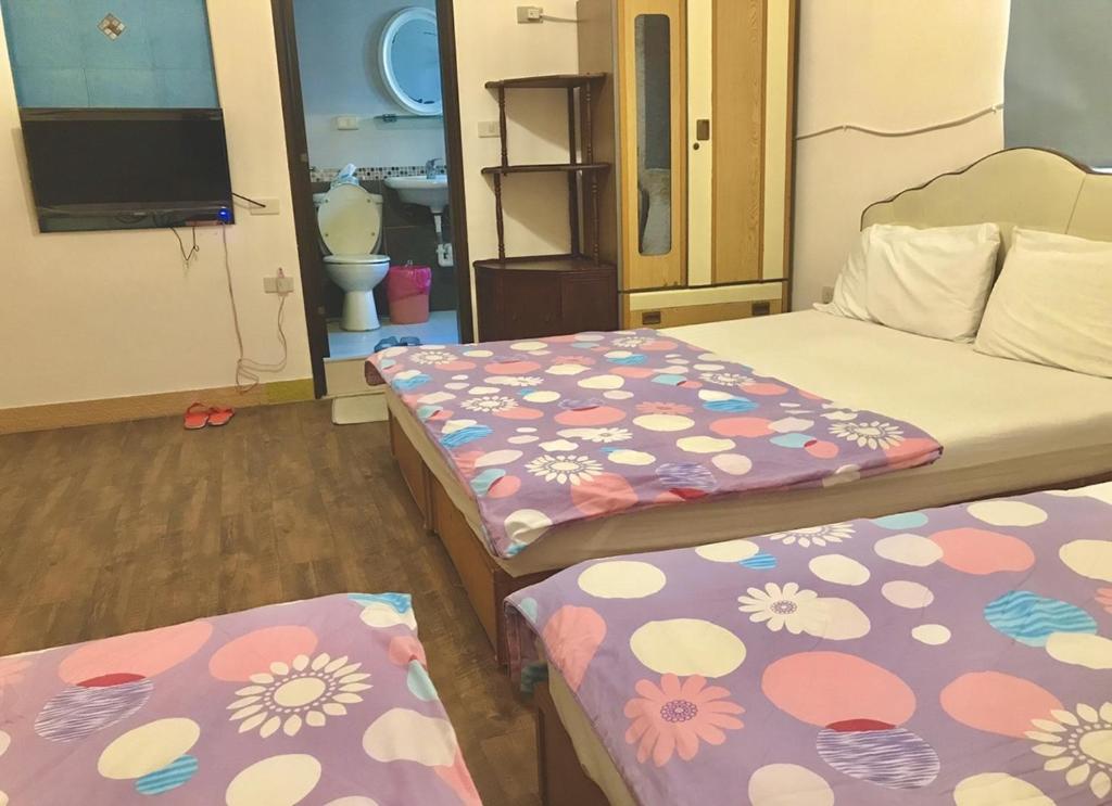 Postel nebo postele na pokoji v ubytování Fu Yuan B&B