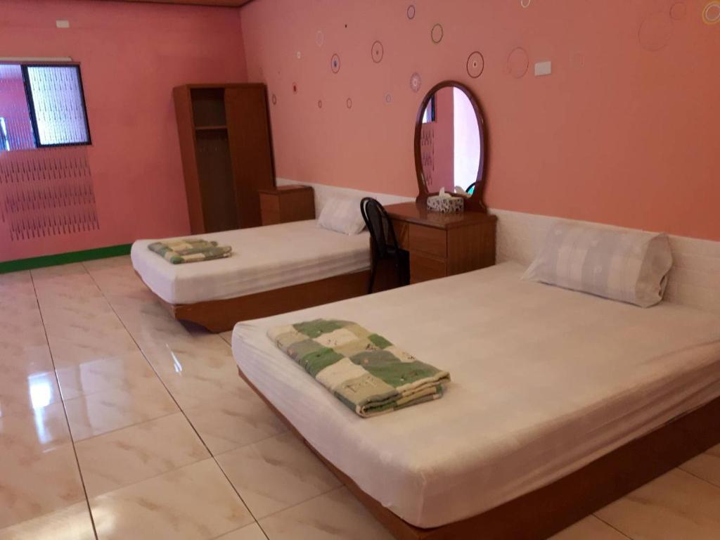 Postel nebo postele na pokoji v ubytování Pthles Guest house