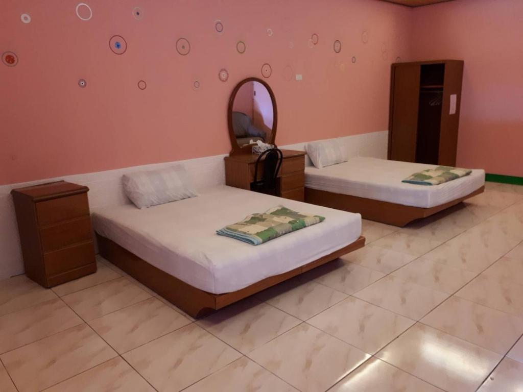 Postel nebo postele na pokoji v ubytování Pthles Guest house