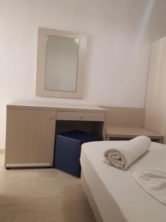 A bed or beds in a room at Sophie Studios