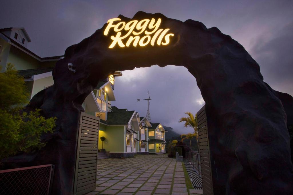 a sign that says fogi knolis on a building at Foggy Knolls Resort in Vagamon