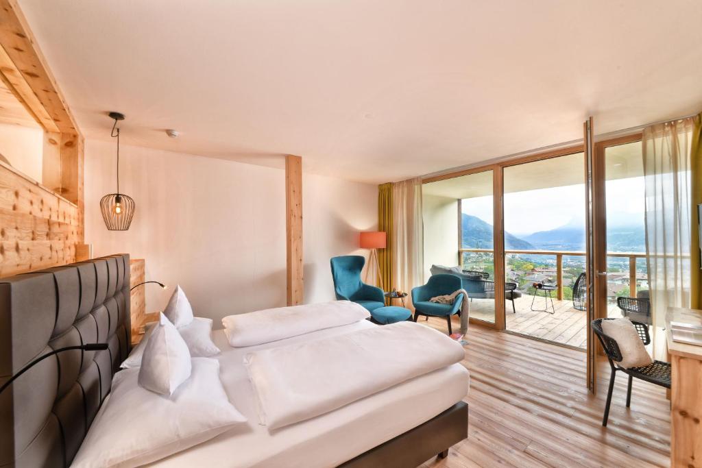 Postel nebo postele na pokoji v ubytování Hotel Ortler