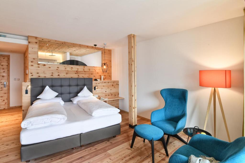 Postel nebo postele na pokoji v ubytování Hotel Ortler