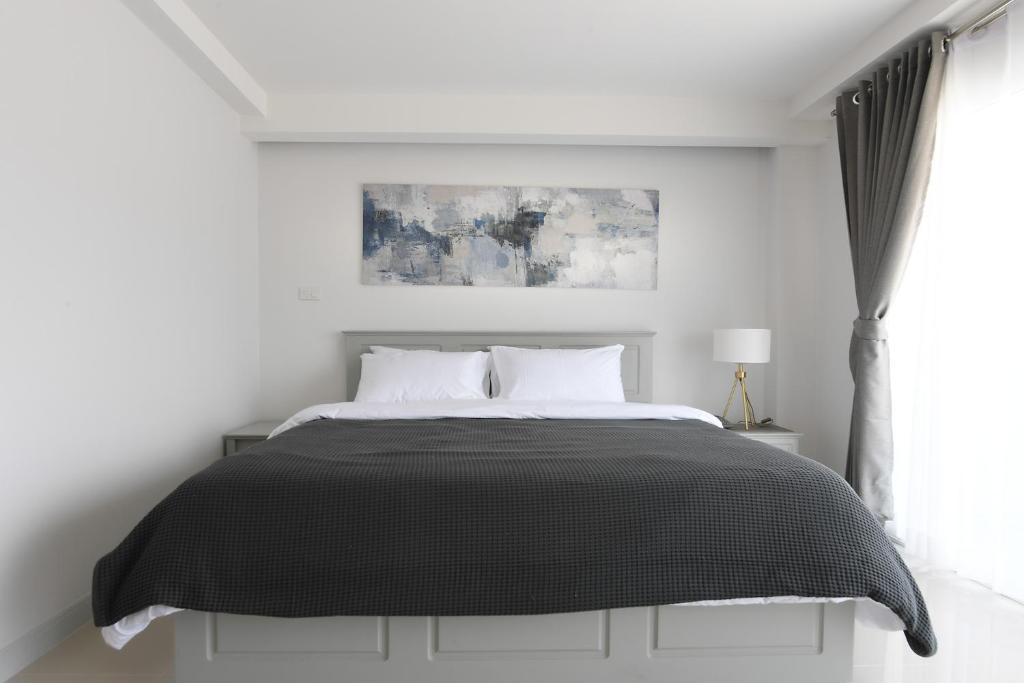 Postel nebo postele na pokoji v ubytování Tonkla Boutique Hotel