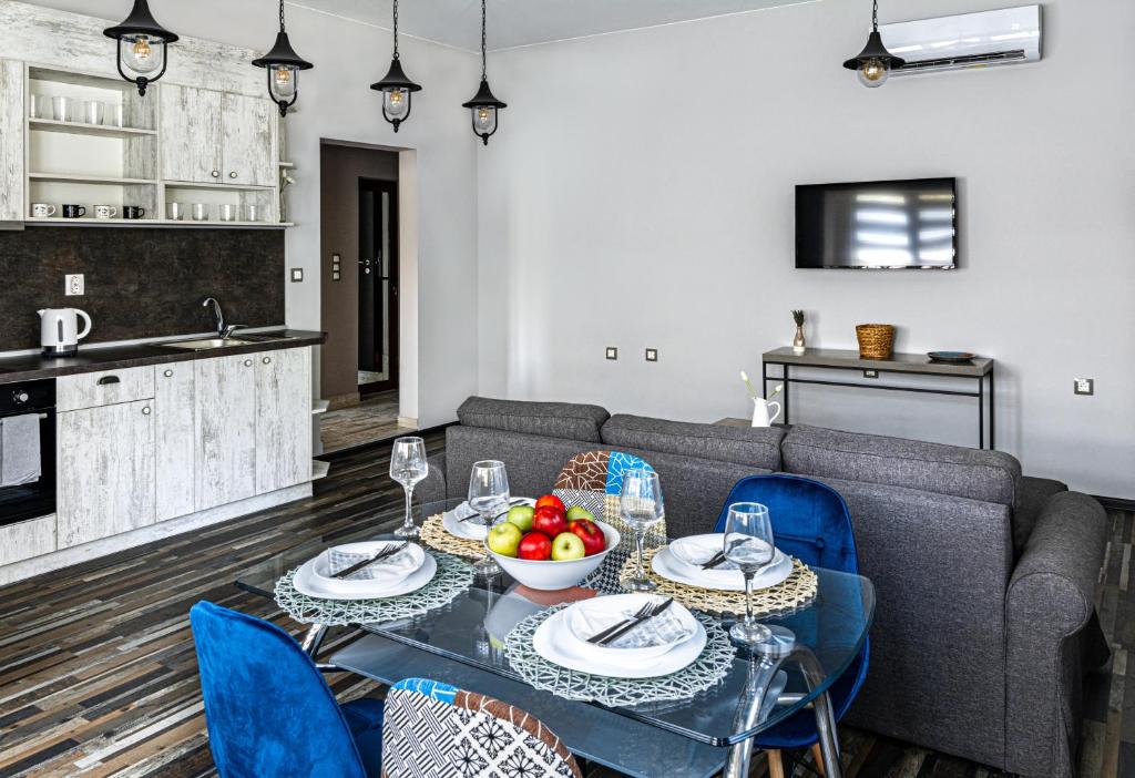 a living room with a table and a couch at Gladstone suites in Plovdiv