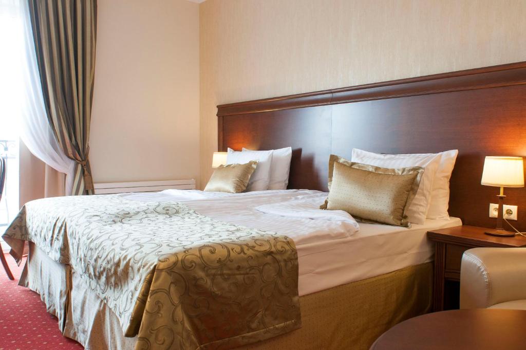 Postel nebo postele na pokoji v ubytování Hotel Splendor