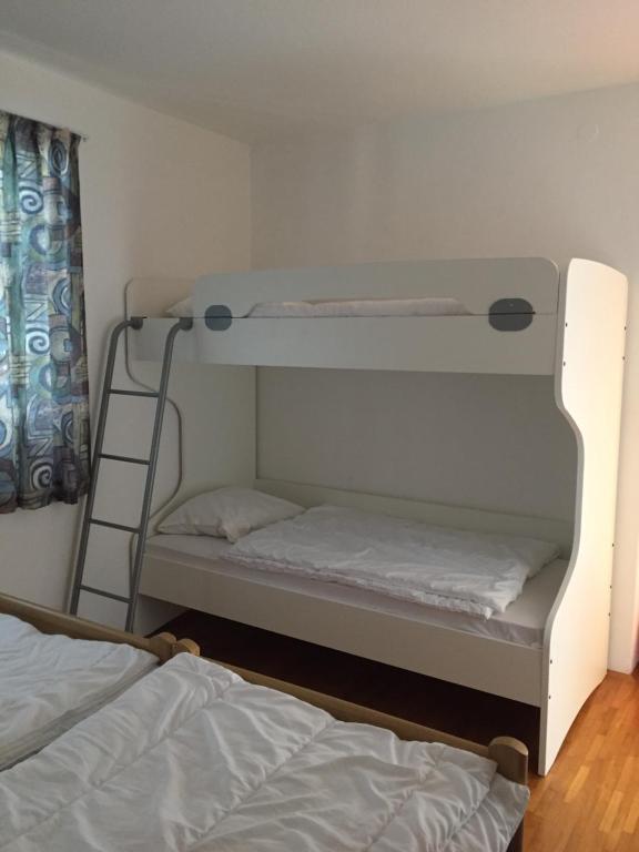 Ένα ή περισσότερα κρεβάτια σε δωμάτιο στο Apartment Tessa met Dakterras en Zeezicht Airco Wifi en Zwembad