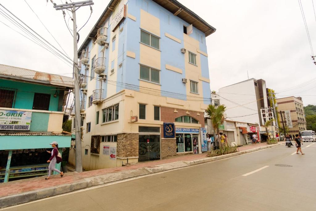 a building on the side of a city street at Bora Sky Hotel in Boracay