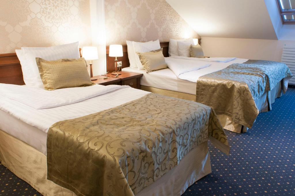 Postel nebo postele na pokoji v ubytování Hotel Splendor