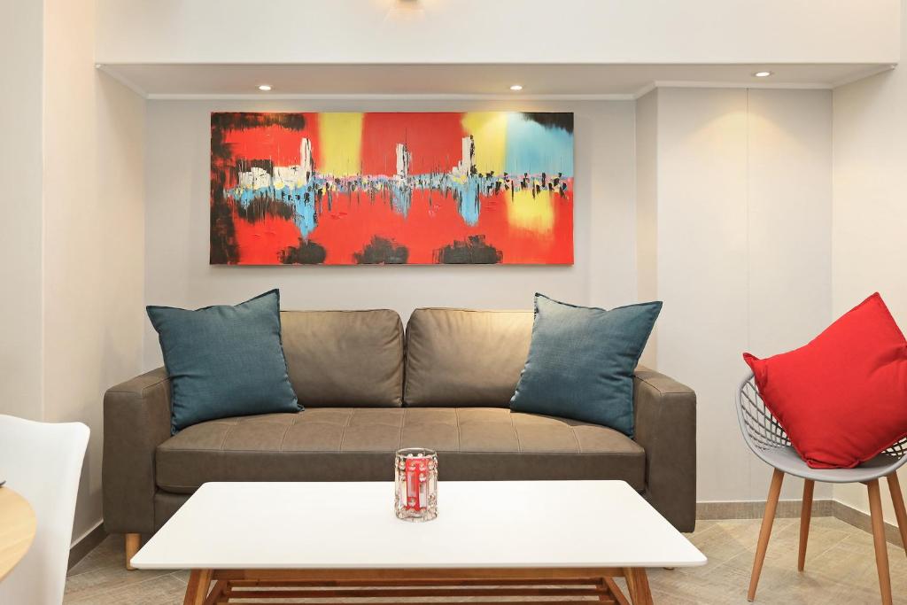 a living room with a couch and a painting on the wall at G Zero 3 @ The Breakers in Hout Bay