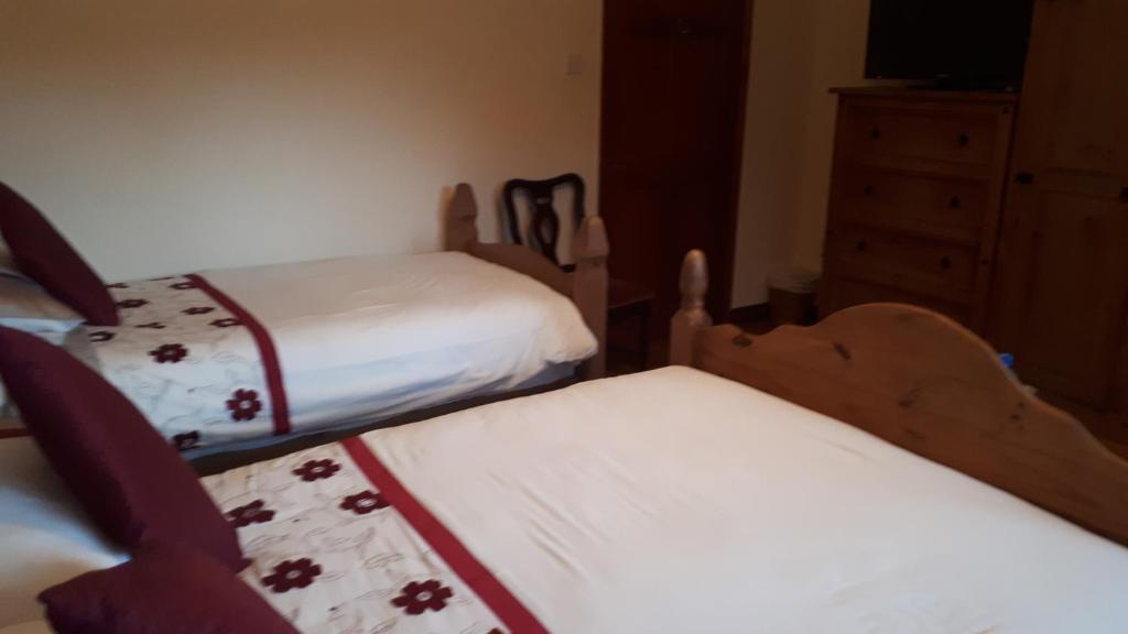 Postel nebo postele na pokoji v ubytování Birchdale House B&B