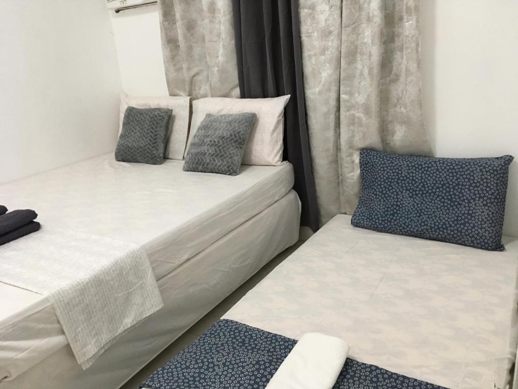 Postel nebo postele na pokoji v ubytování Bolinao Transient House B