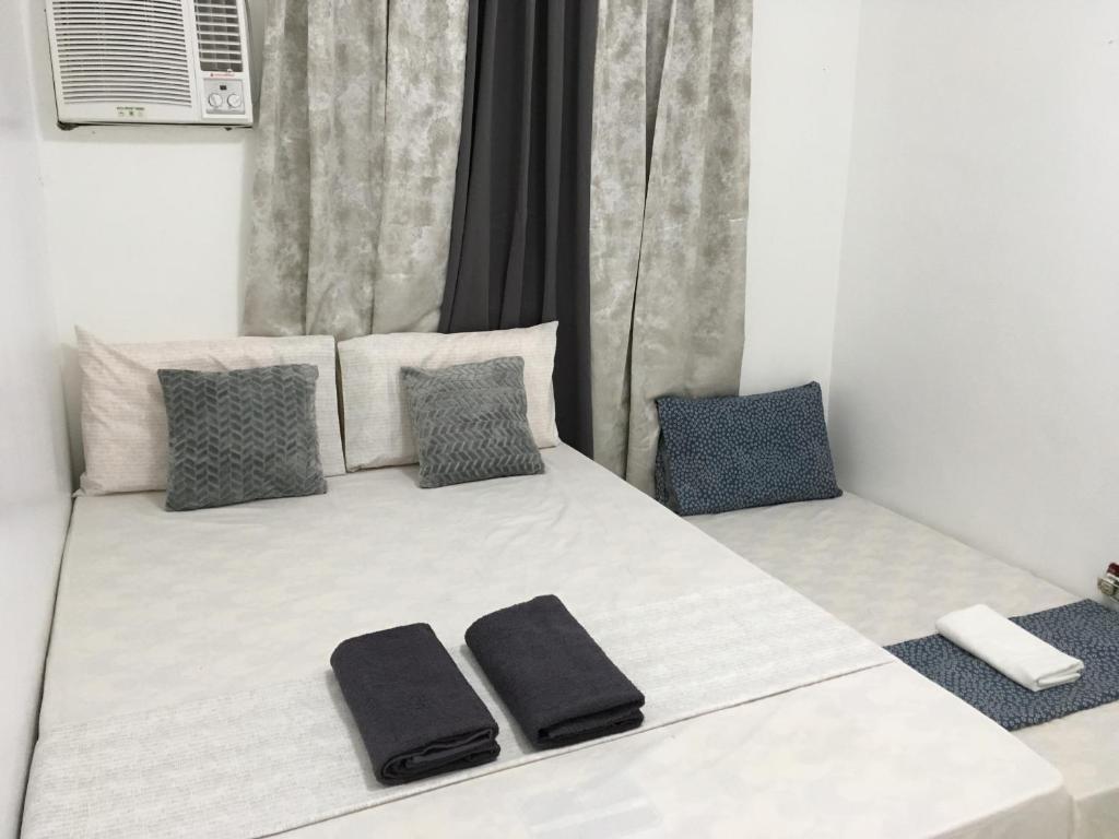 Postel nebo postele na pokoji v ubytování Bolinao Transient House B