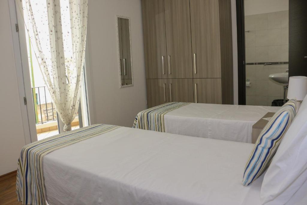 Postel nebo postele na pokoji v ubytování B&B Incanto Salento