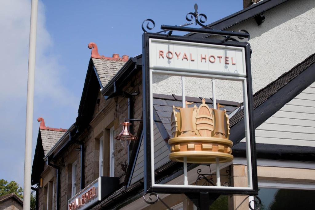 a sign for a royal hotel on the side of a building at The Royal Hotel in Bolton le Sands