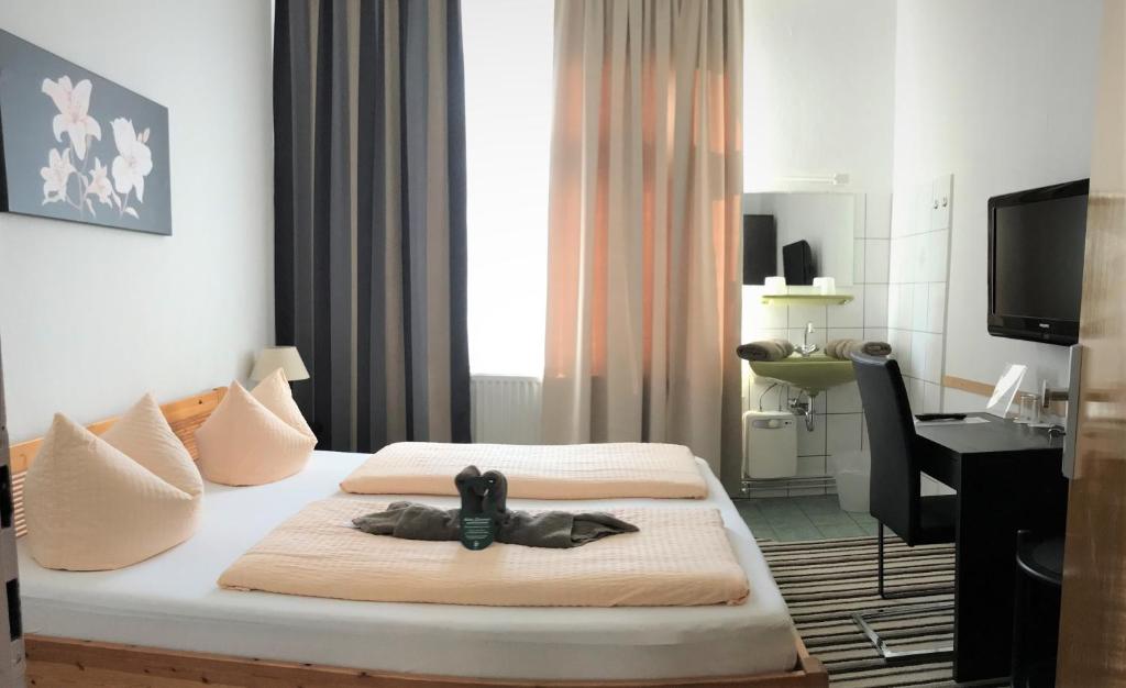 Postel nebo postele na pokoji v ubytování Hotel Antoni