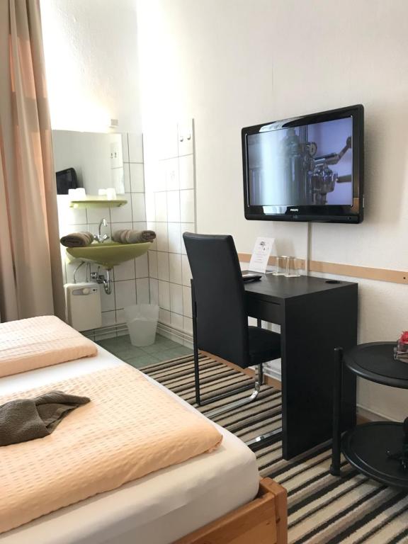 TV a/nebo společenská místnost v ubytování Hotel Antoni