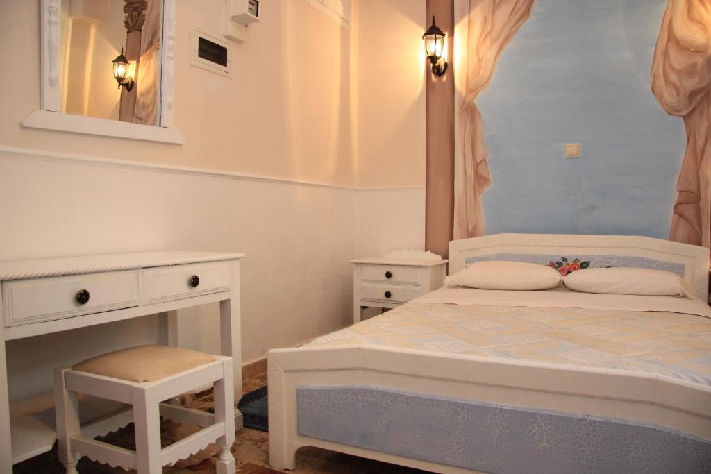Ένα ή περισσότερα κρεβάτια σε δωμάτιο στο Dorian Hotel
