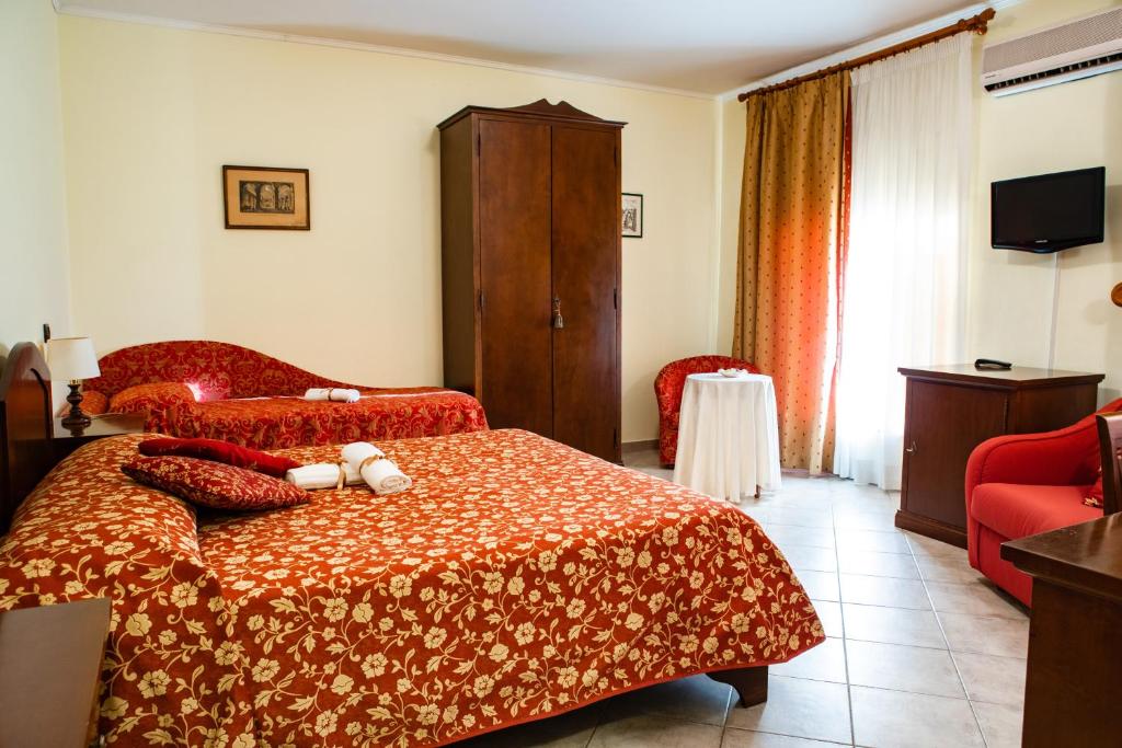 Postel nebo postele na pokoji v ubytování Hotel Il Cavalier D'Arpino