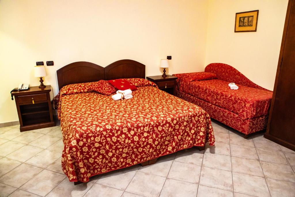 Postel nebo postele na pokoji v ubytování Hotel Il Cavalier D'Arpino